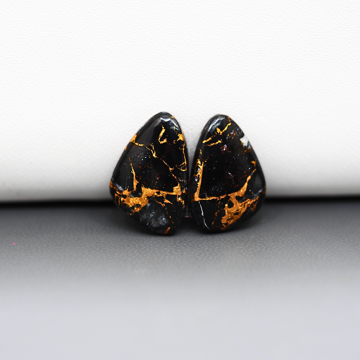 Kingman Black Buffalo Copper Composite Freeform Cabochon Pair 17x11x3mm 10ct - black stone with bright copper veins - Pedra Gems