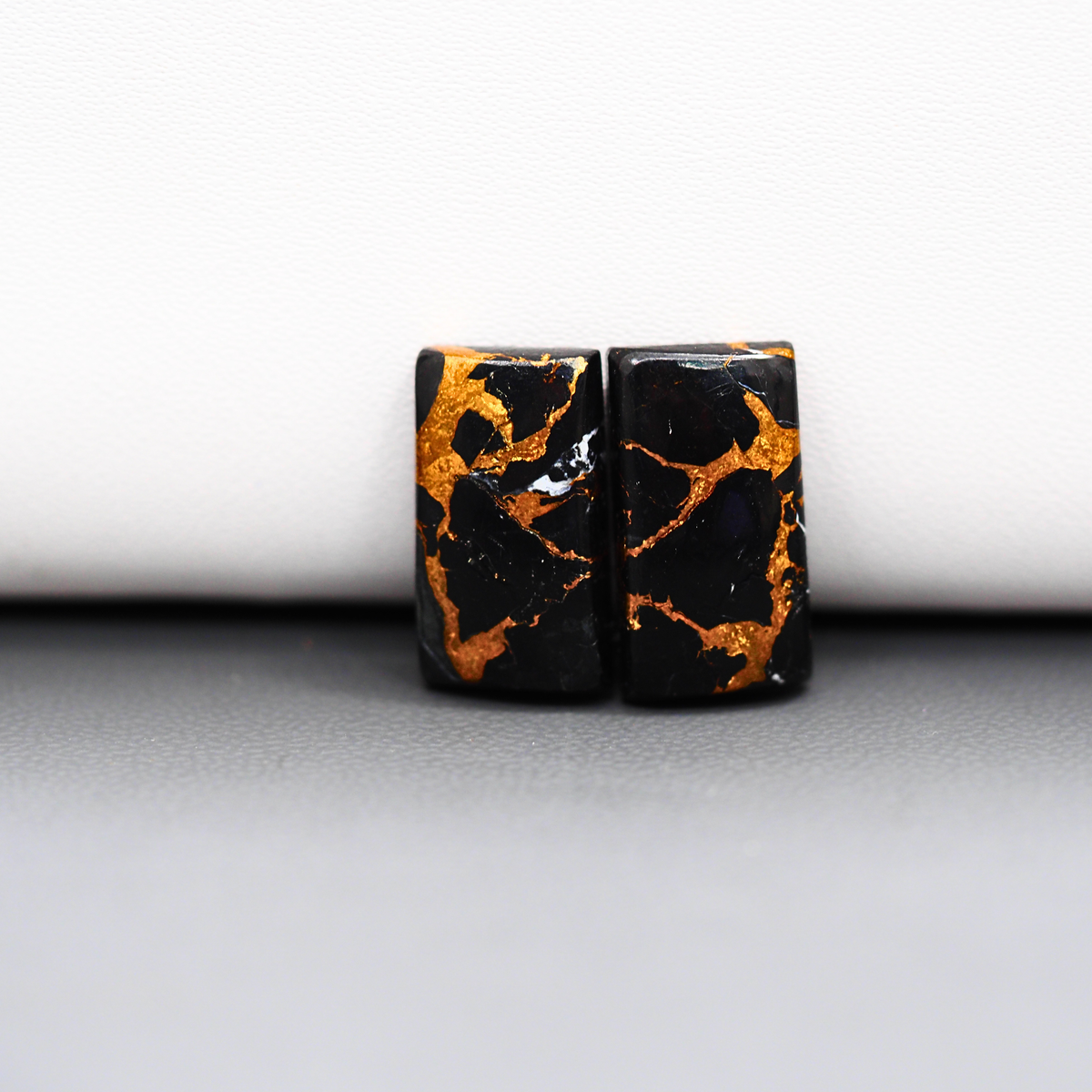 Kingman Black Buffalo Copper Composite Baguette Cabochon Pair 18x9x4mm 14ct - black stone with bright copper veins - Pedra Gems
