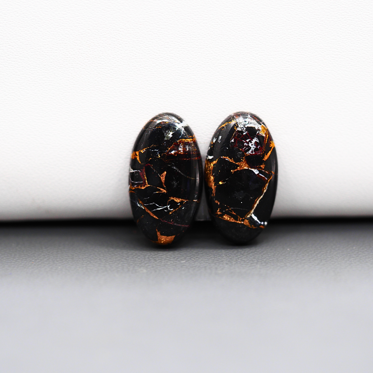 Kingman Black Buffalo Copper Composite Oval Cabochon Pair 20x11x3mm 14ct - black stone with bright copper veins - Pedra Gems