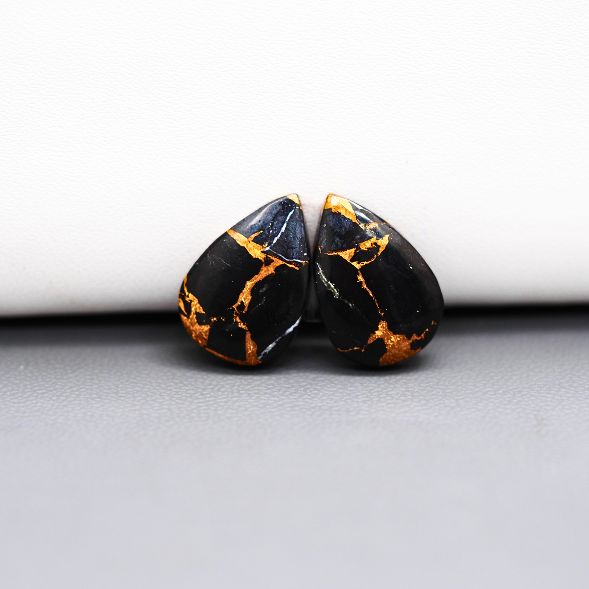 Kingman Black Buffalo Copper Composite Pear Cabochon Pair 17x11x3mm 12ct - black stone with bright copper veins - Pedra Gems