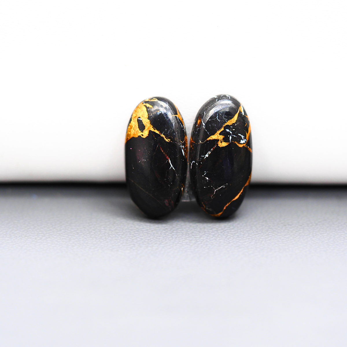 Kingman Black Buffalo Copper Composite Oval Cabochon Pair 20x10x3mm 13ct - black stone with bright copper veins - Pedra Gems