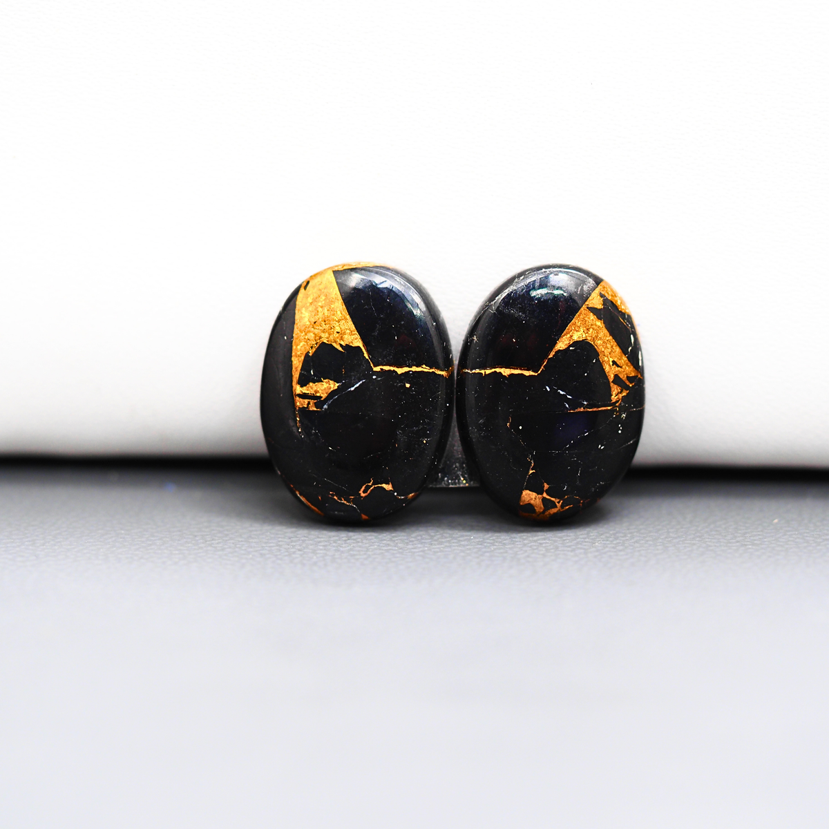 Kingman Black Buffalo Copper Composite Oval Cabochon Pair 16x12x3mm 14ct - black stone with bright copper veins - Pedra Gems
