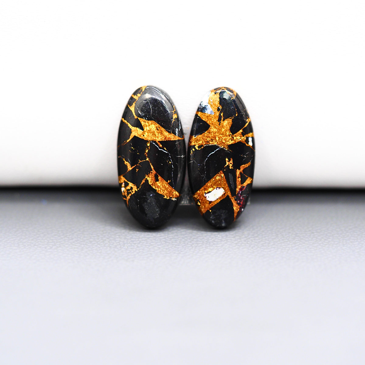 Kingman Black Buffalo Copper Composite Oval Cabochon Pair 21x10x3mm 10.5ct - black stone with bright copper veins - Pedra Gems