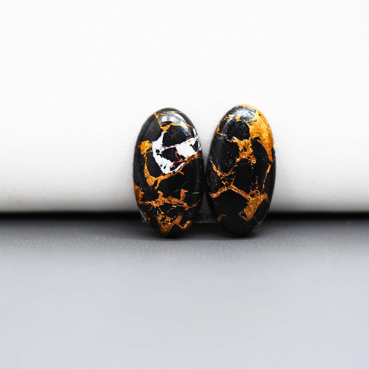 Kingman Black Buffalo Copper Composite Oval Cabochon Pair 19x10x4mm 13ct - black stone with bright copper veins - Pedra Gems
