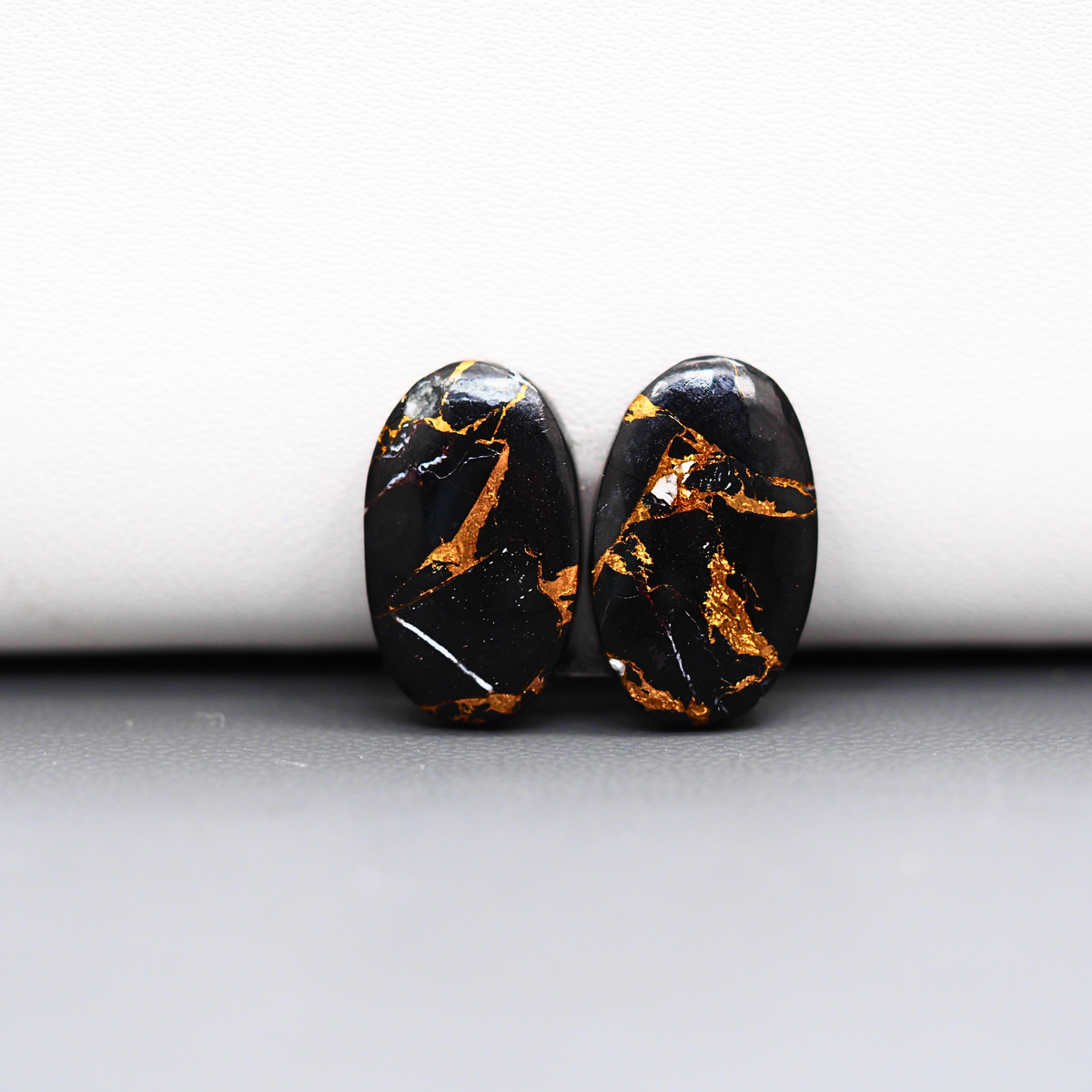 Kingman Black Buffalo Copper Composite Oval Cabochon Pair 17x11x3mm 12ct - black stone with bright copper veins - Pedra Gems
