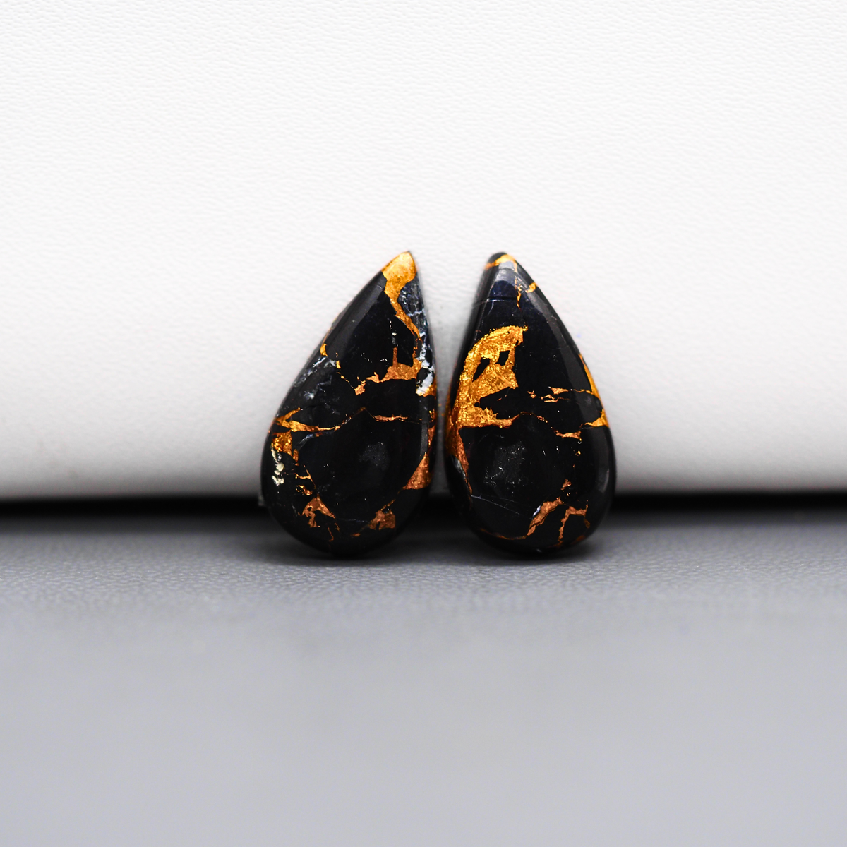 Kingman Black Buffalo Copper Composite Pear Cabochon Pair 20x11x3mm 12ct - black stone with bright copper veins - Pedra Gems