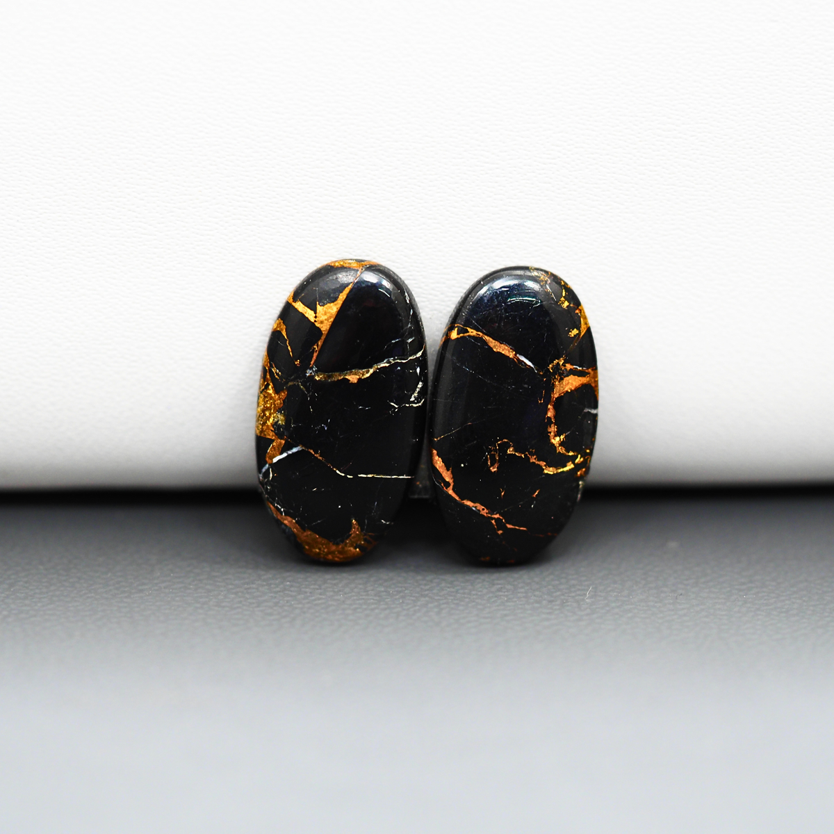 Kingman Black Buffalo Copper Composite Oval Cabochon Pair 20x11x3mm 12.5ct - black stone with bright copper veins - Pedra Gems
