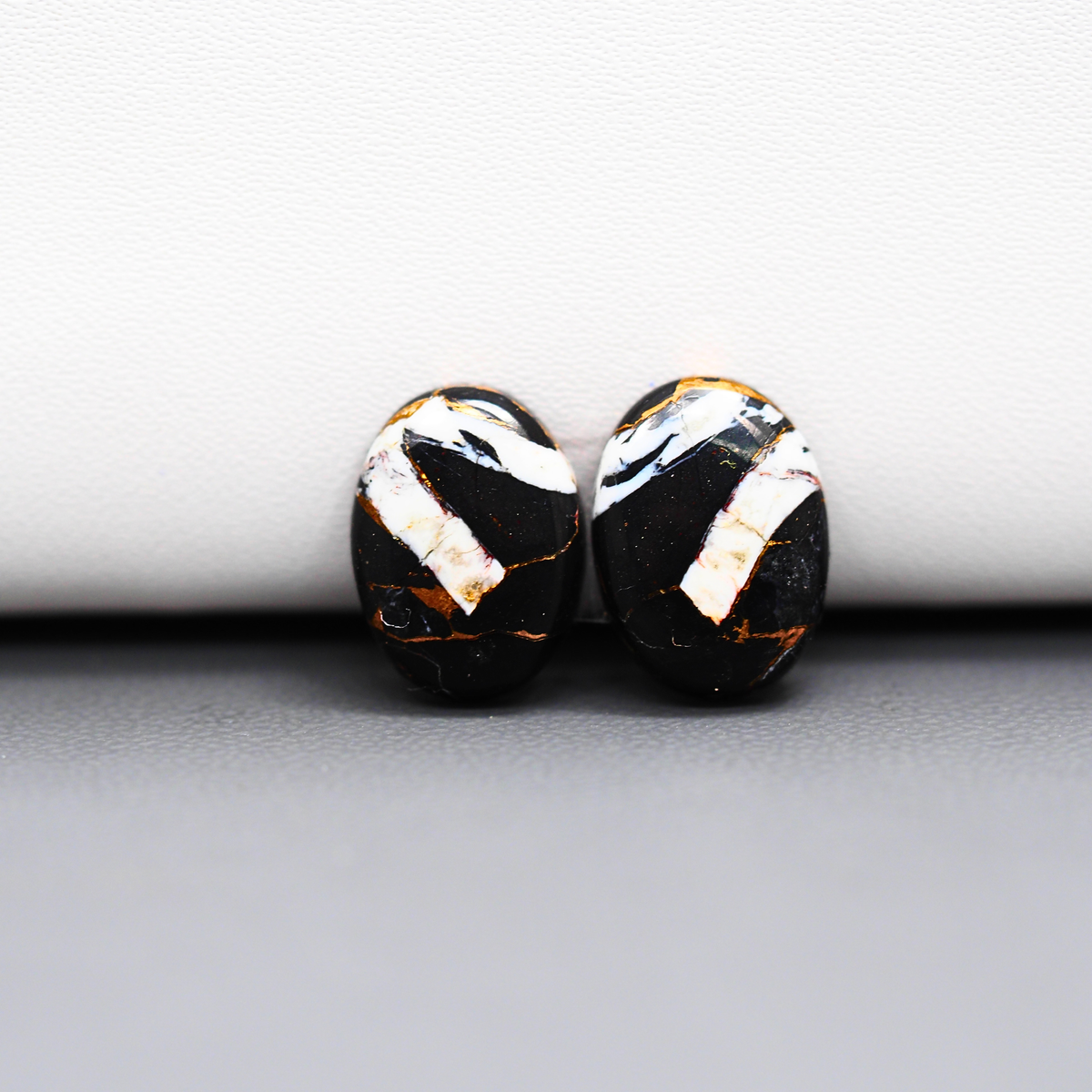 Kingman Black Buffalo Copper Composite Oval Cabochon Pair 14x11x4mm 10ct - black stone with bright copper veins - Pedra Gems