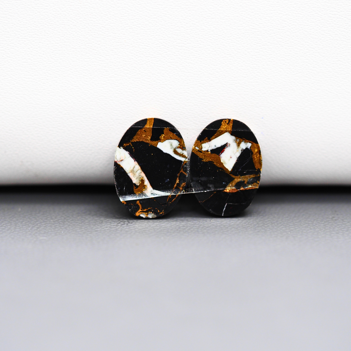 Kingman Black Buffalo Copper Composite Oval Cabochon Pair 14x11x4mm 10ct - black stone with bright copper veins - Pedra Gems
