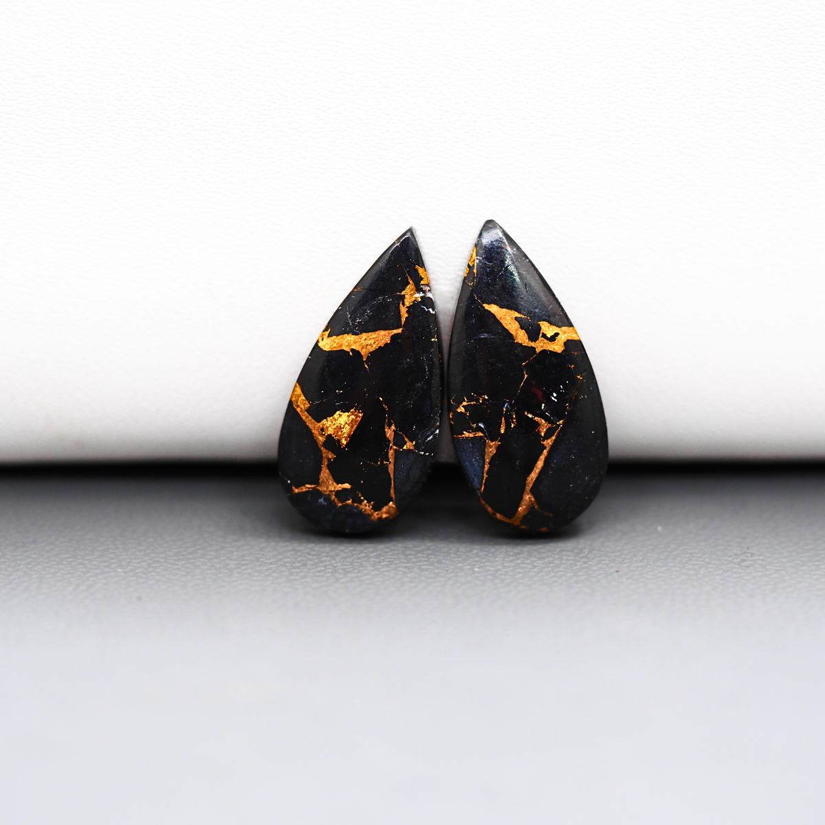 Kingman Black Buffalo Copper Composite Pear Cabochon Pair 21x11x3mm 12.5ct - black stone with bright copper veins - Pedra Gems