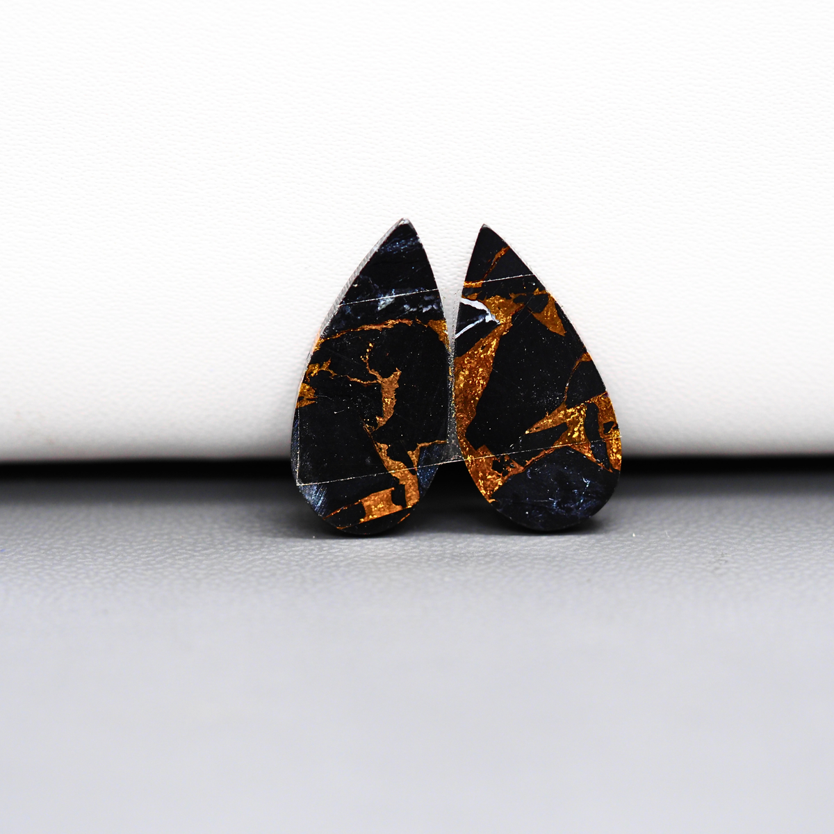 Kingman Black Buffalo Copper Composite Pear Cabochon Pair 21x11x3mm 12.5ct - black stone with bright copper veins - Pedra Gems