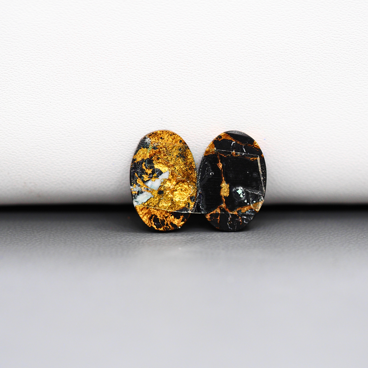 Kingman Black Buffalo Copper Composite Oval Cabochon Pair 15x10x3mm 9ct - black stone with bright copper veins - Pedra Gems