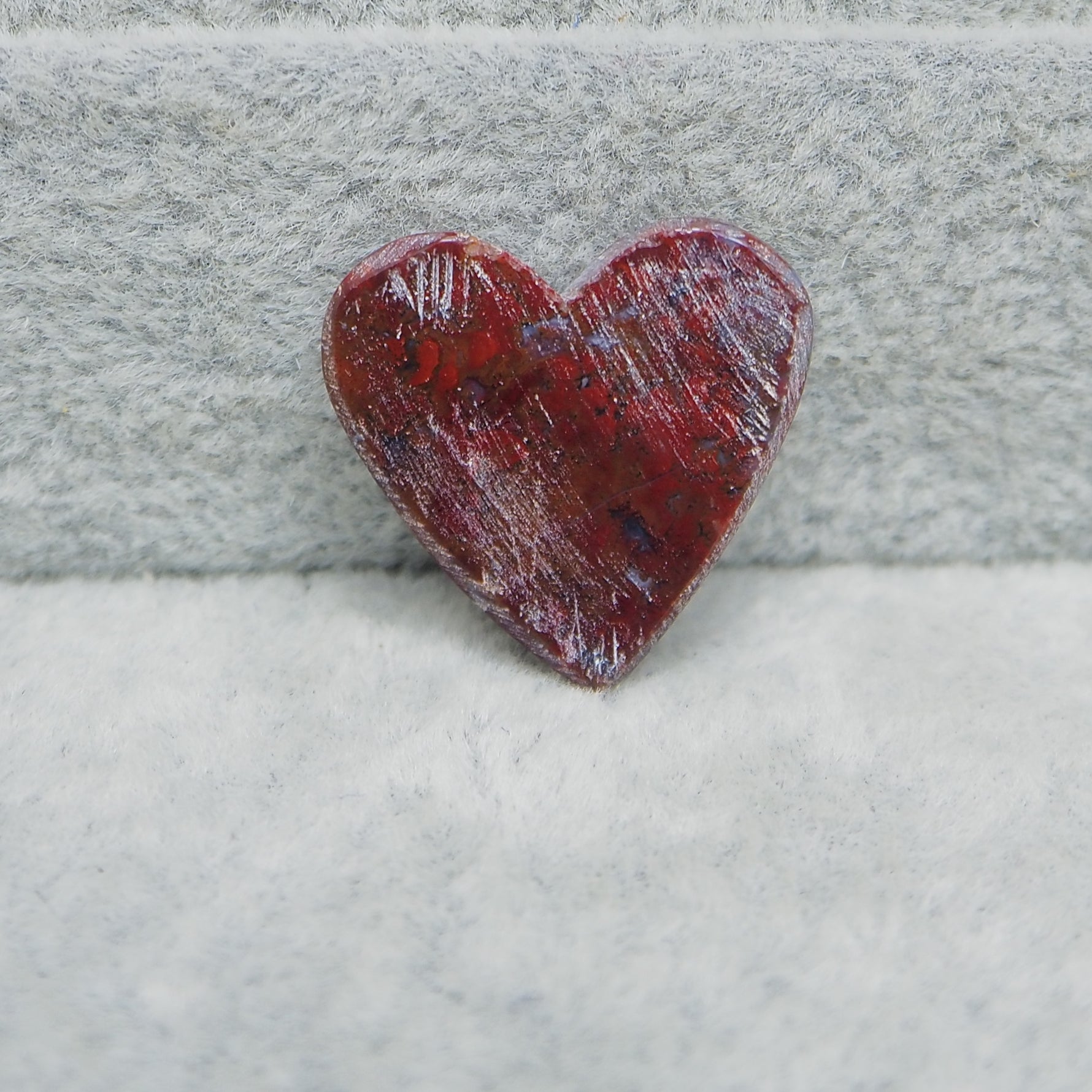 Small Seam Agate heart cabochon 13x14mm next to ruler for size reference
