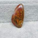 Translucent Seam Agate cabochon 15ct backlit showing glowing light through stone