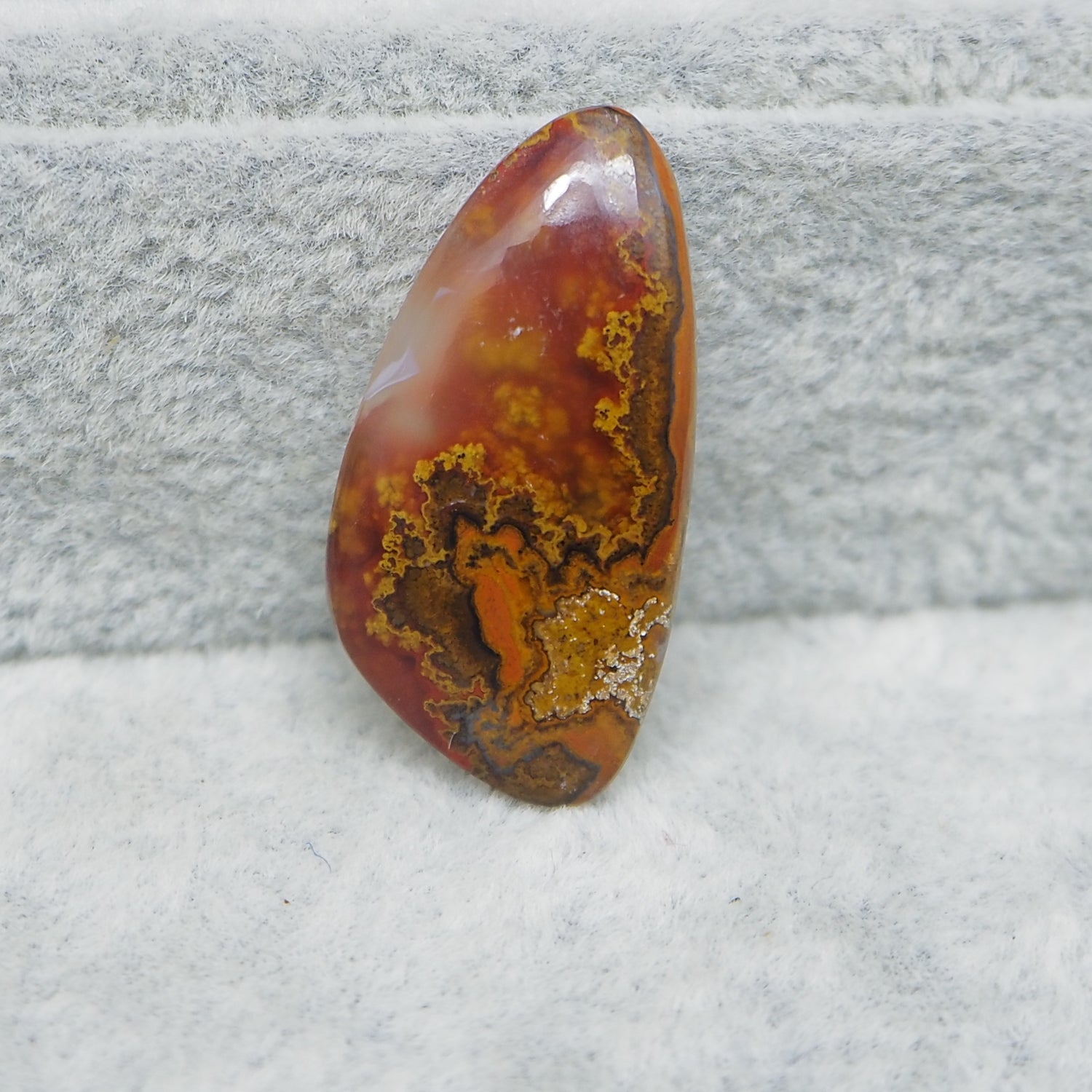 Translucent Seam Agate cabochon 15ct backlit showing glowing light through stone