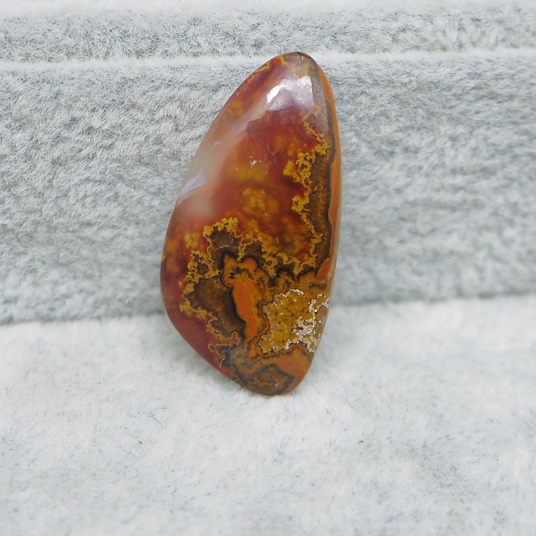Translucent Seam Agate cabochon 15ct backlit showing glowing light through stone