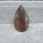 Seam Agate pear cabochon 30x17mm next to ruler for size reference