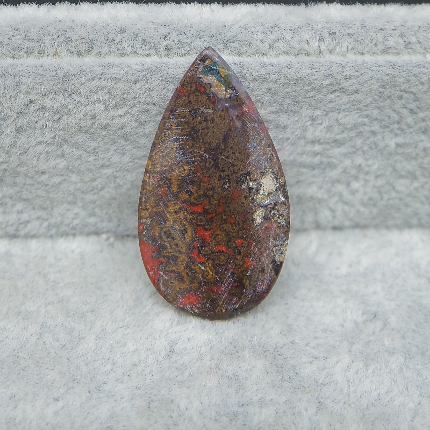 Seam Agate pear cabochon 30x17mm next to ruler for size reference
