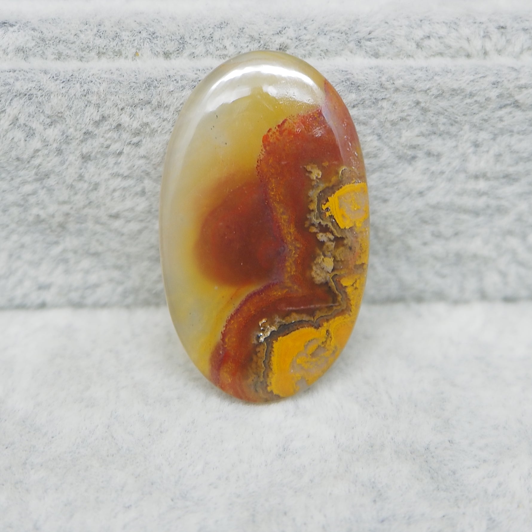 Natural Seam Agate translucent oval cabochon 29x17mm front view banding detail