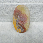 Seam Agate oval cabochon 29x17mm side profile showing low 3mm dome