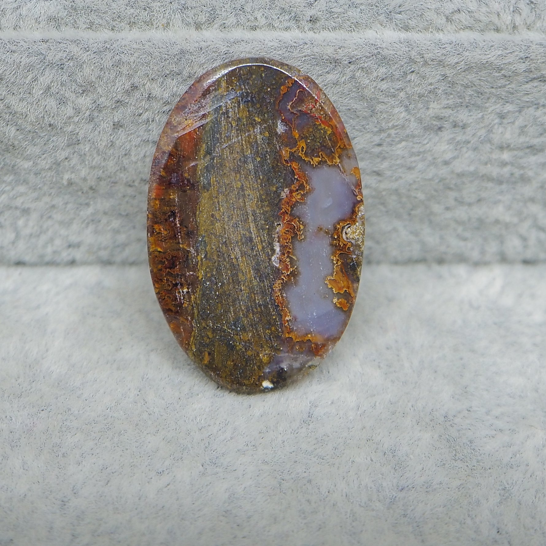 Seam Agate oval cabochon 28x18mm next to ruler for size reference