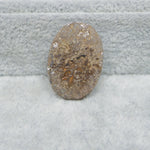  Seam Agate oval cabochon 25x18mm next to ruler for size reference Pedra Gems