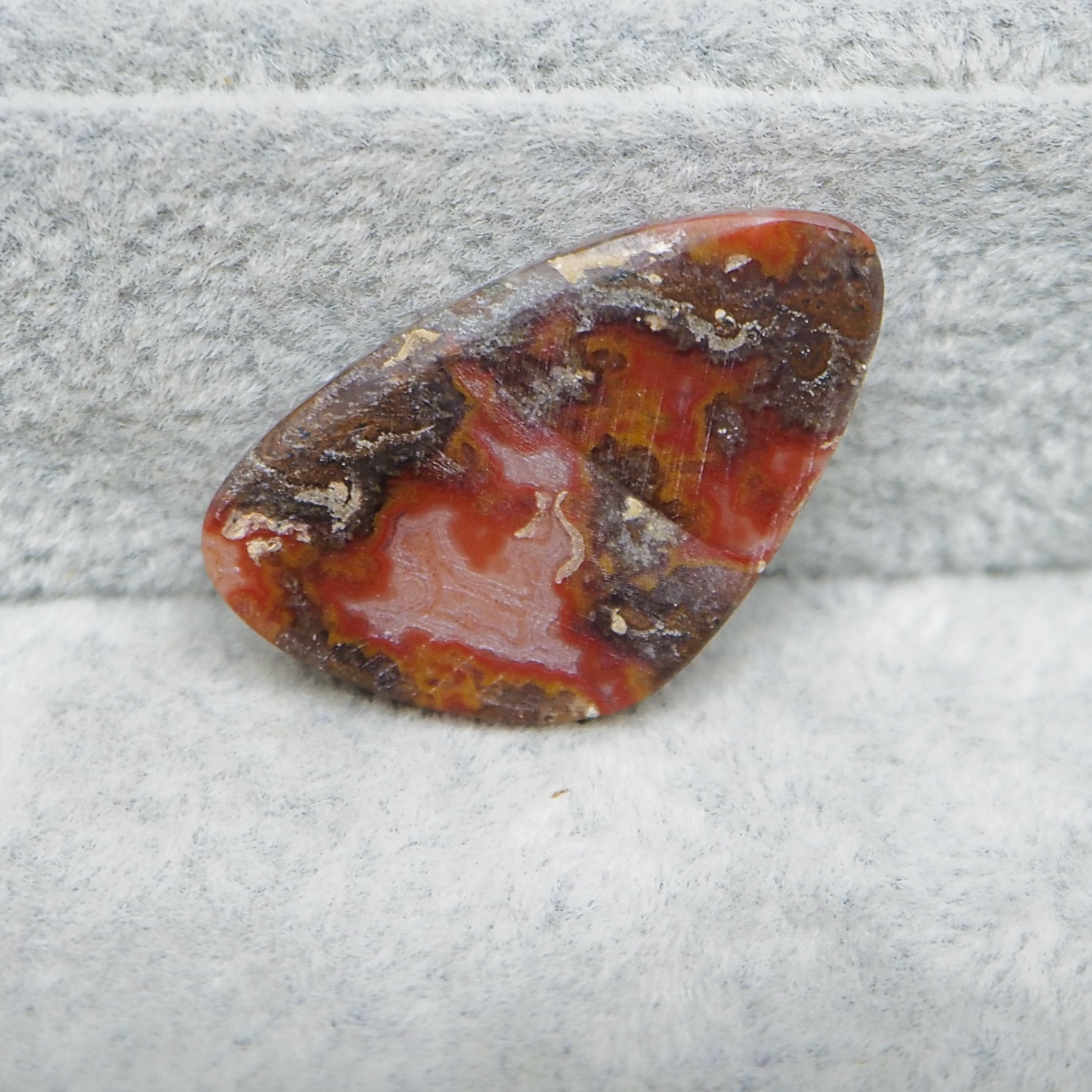 Smooth large organic natural agate tumble gemstone close-up banding detail
