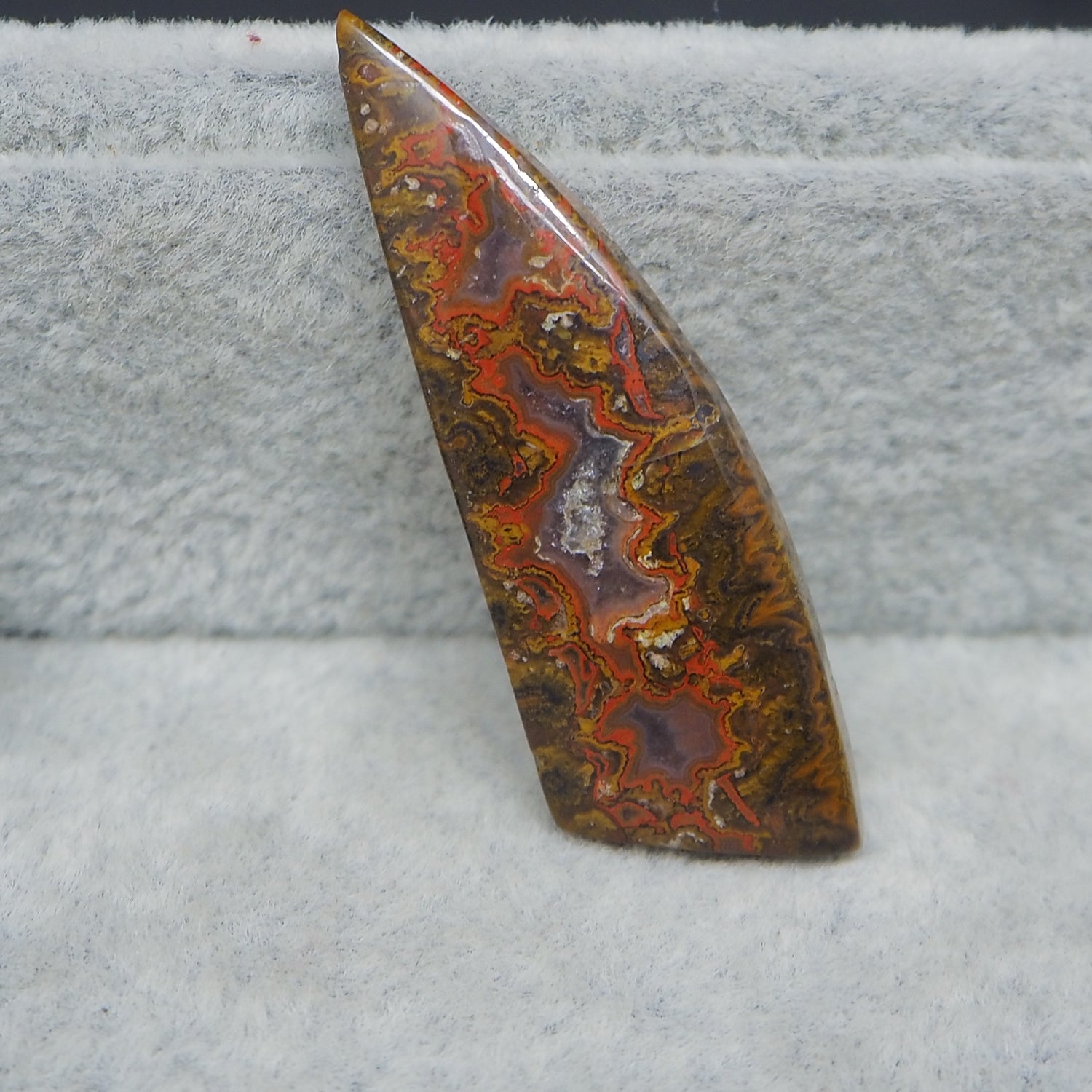 Marbled stone on a textured gray surface