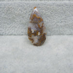 Geode crystal on a textured gray surface