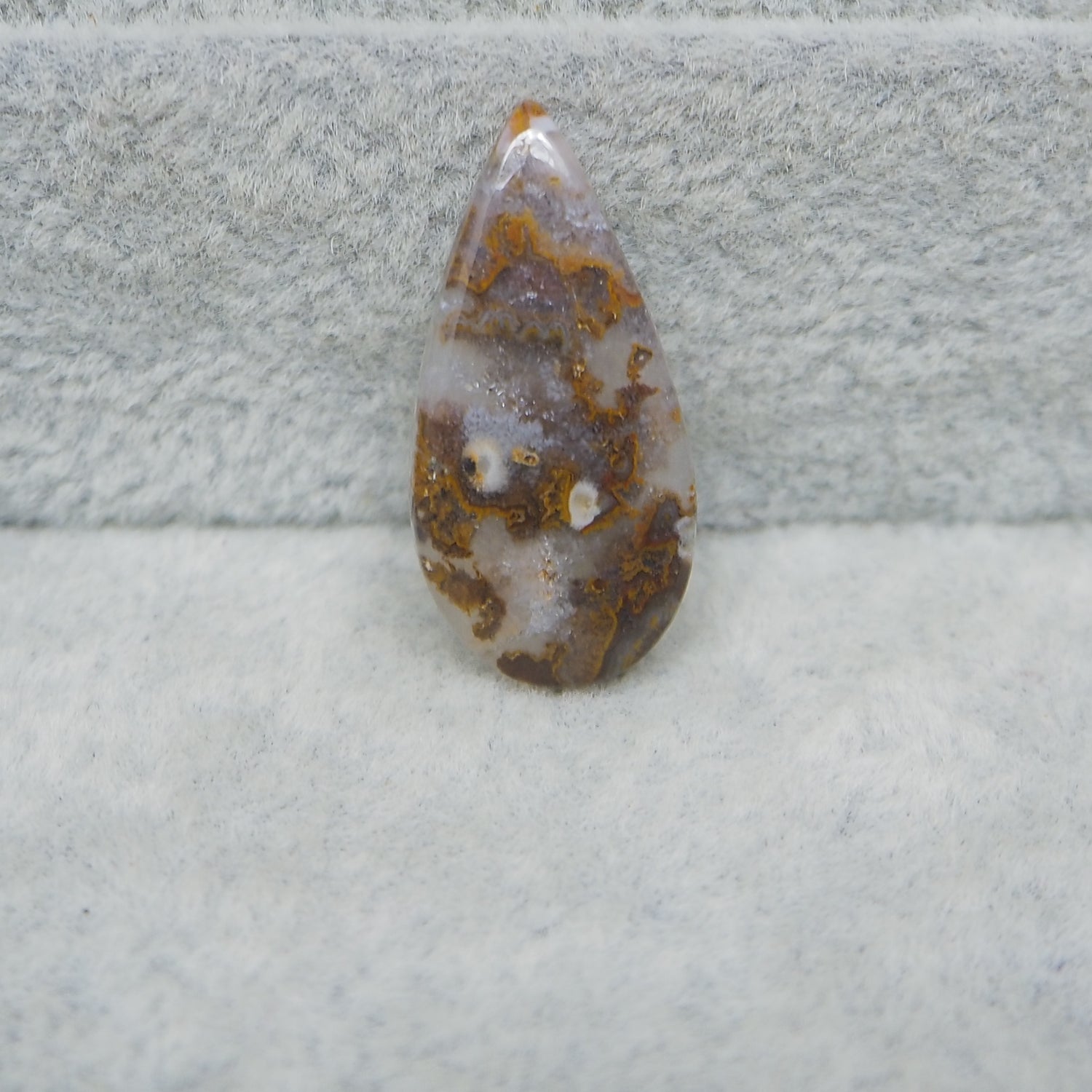Geode crystal on a textured gray surface