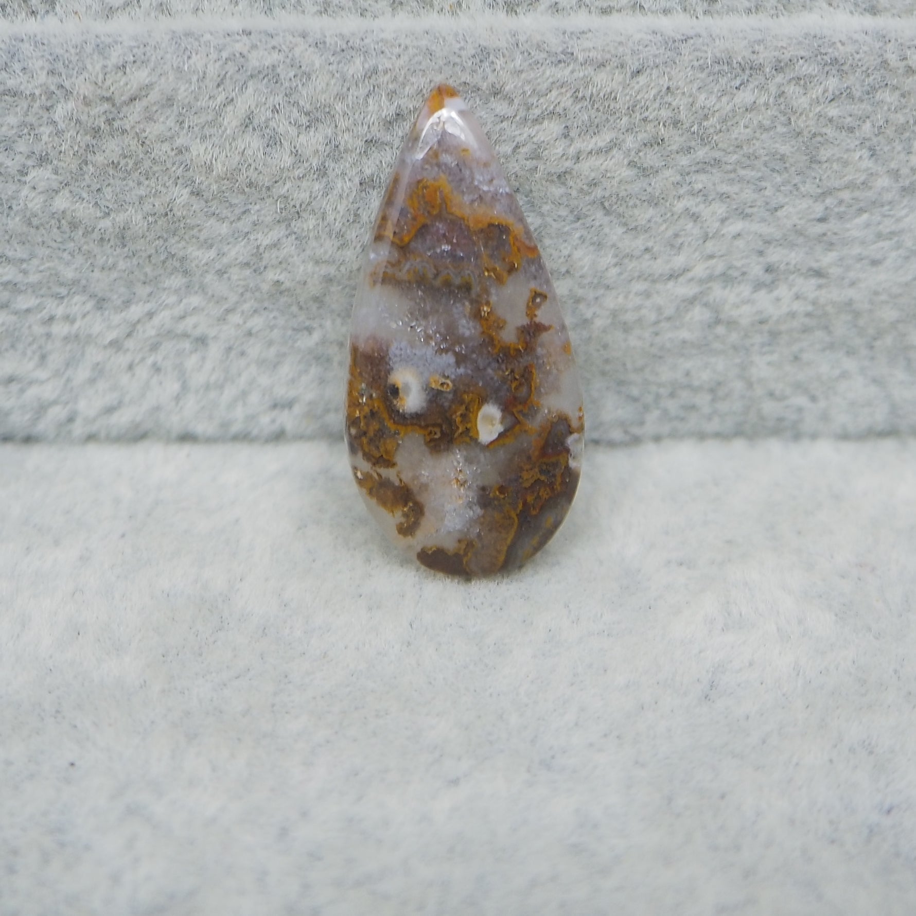 Geode crystal on a textured gray surface