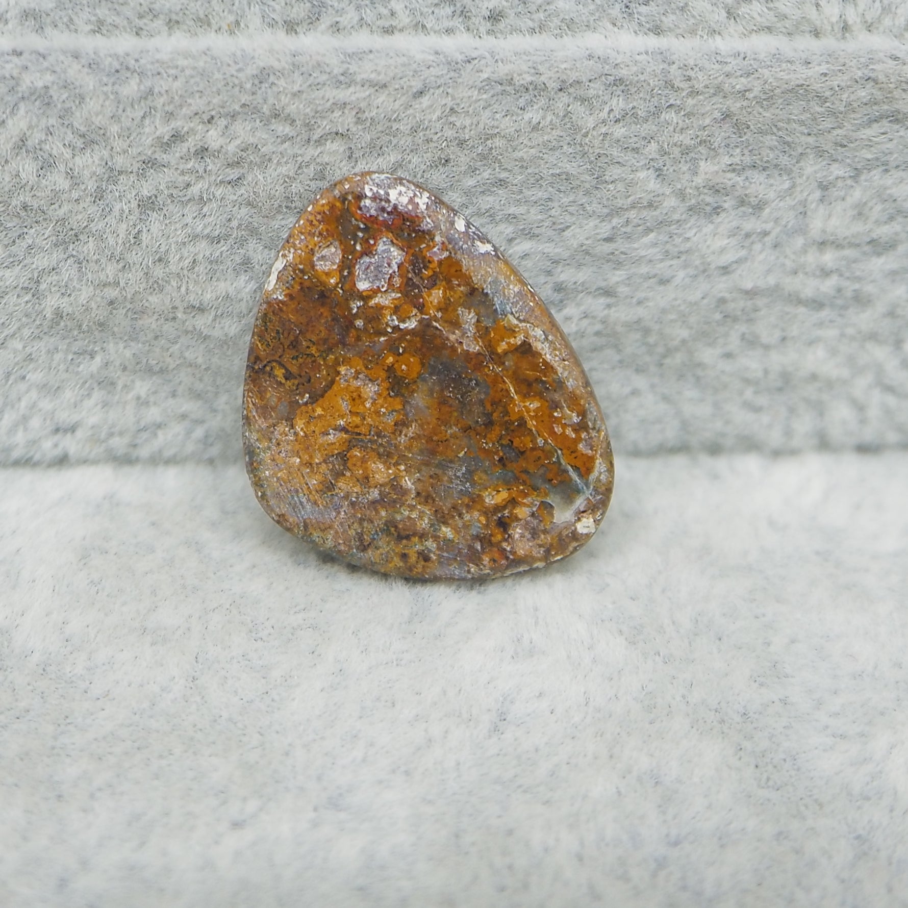Rusty metal object on a textured gray surface