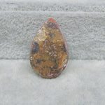 Brown stone on a gray surface