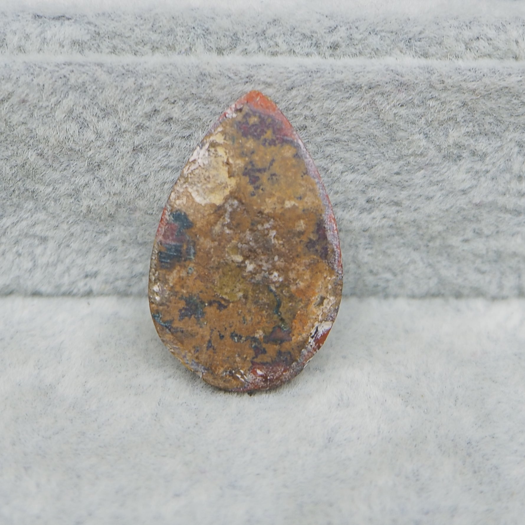 Brown stone on a gray surface