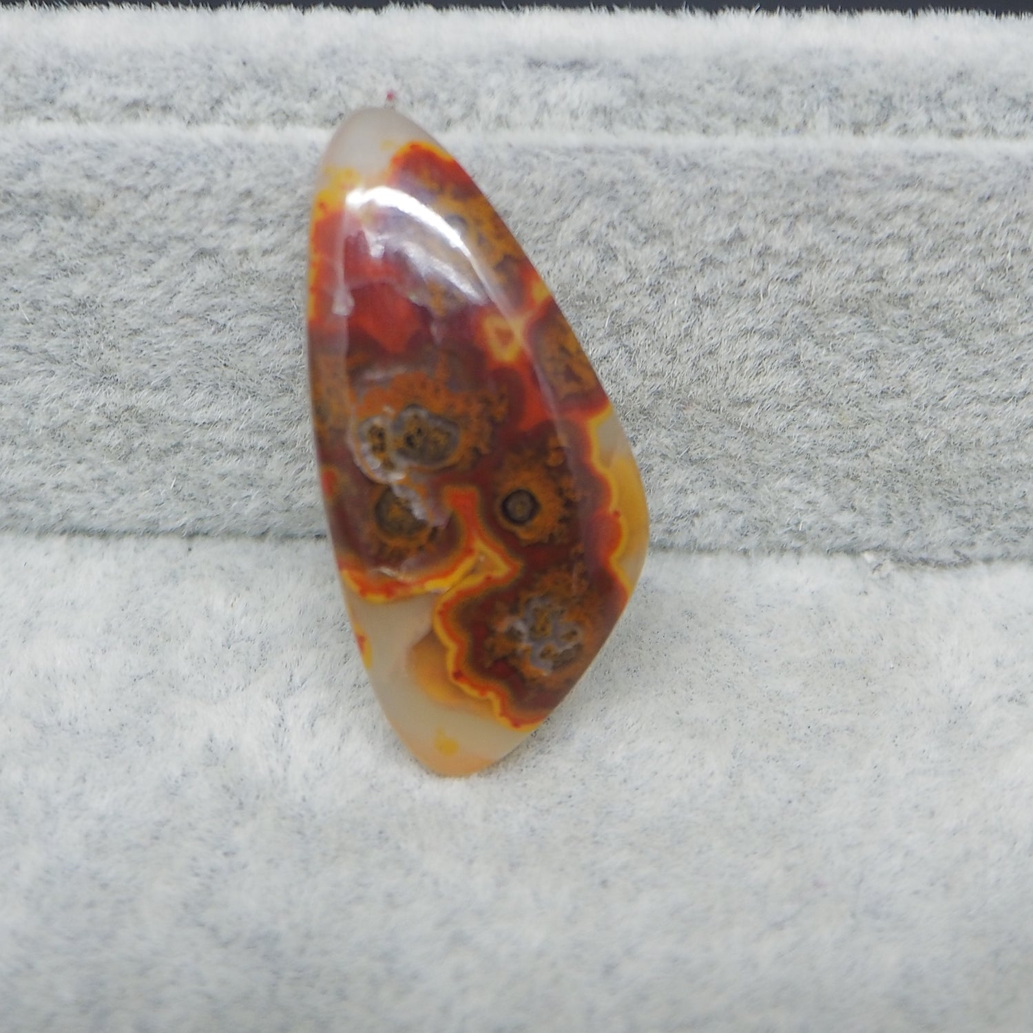 Marbled stone on a textured gray surface