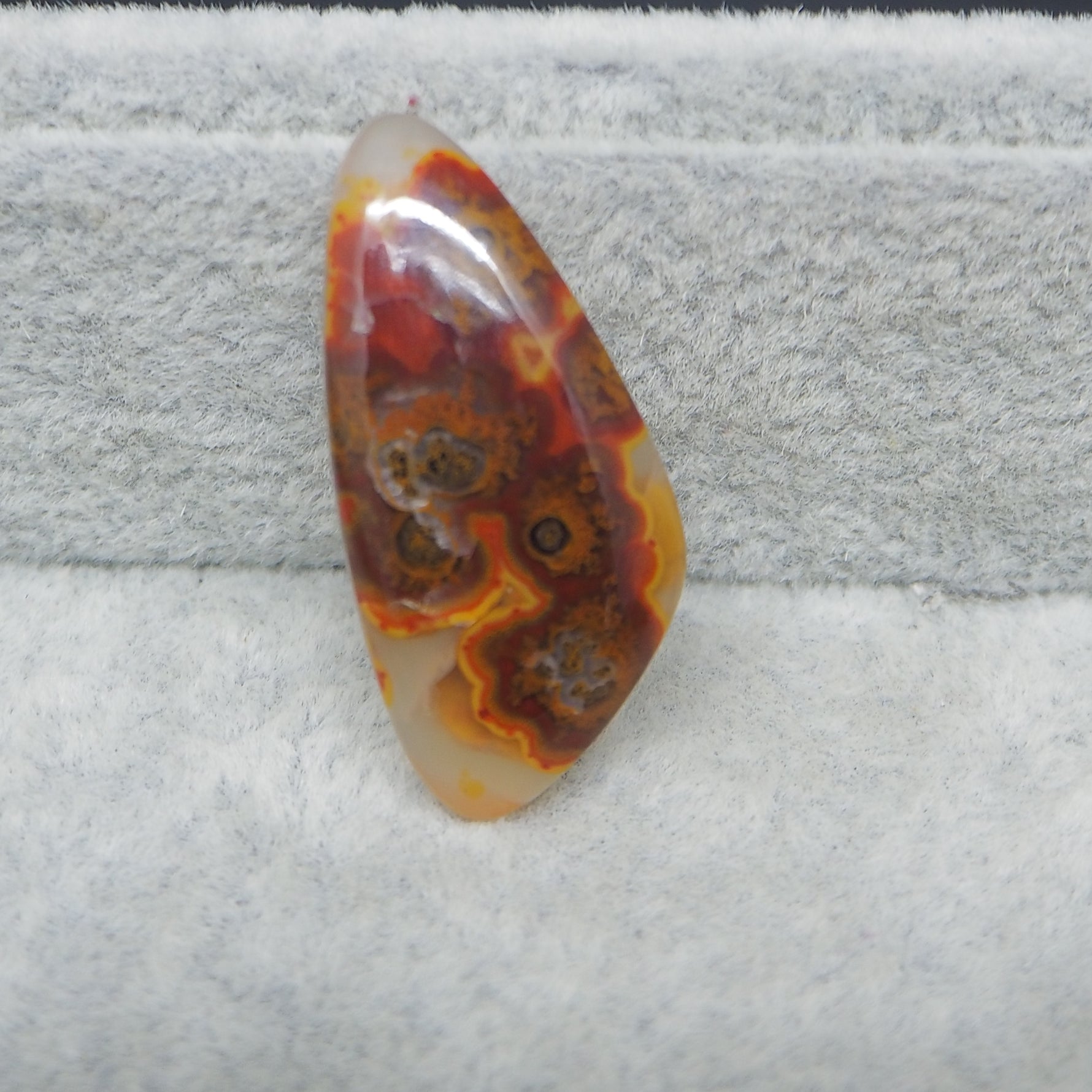 Marbled stone on a textured gray surface