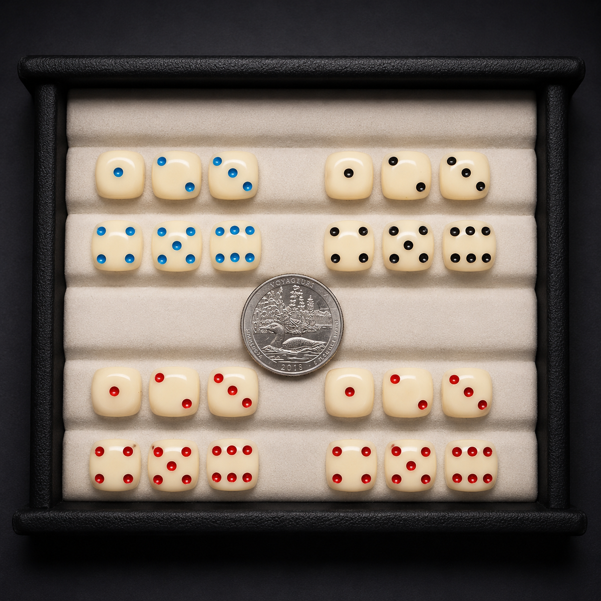 Set of dice with different color dot patterns on a black background