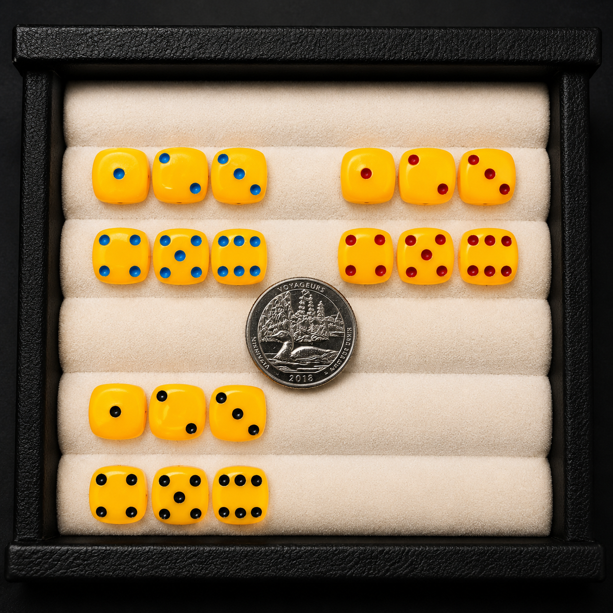 Set of yellow dice with different numbers on a black frame