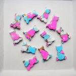 Colorful cat-shaped cookies on a white tray