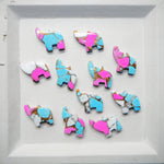 Colorful elephant-shaped cookies on a white tray
