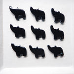 Black elephant-shaped earrings on a white background