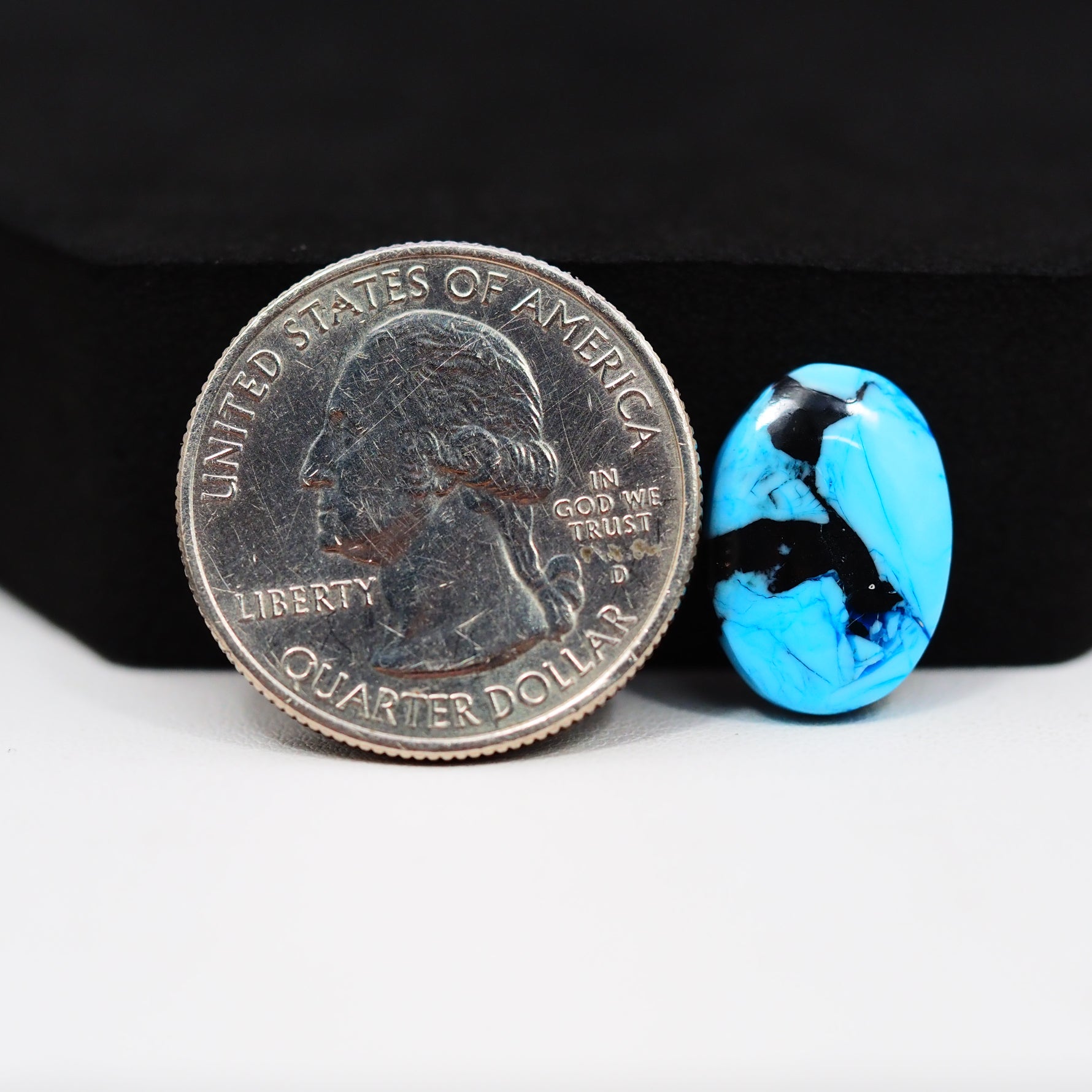 Buffalo Oval Cabochon 16x11mm 6.5ct - Blue with Black Inclusions - Pedra Gems