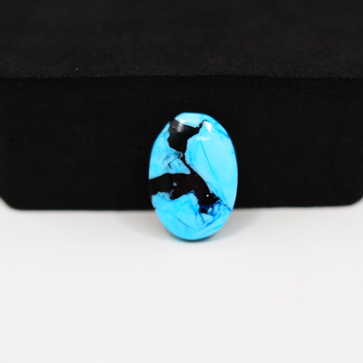 Buffalo Oval Cabochon 16x11mm 6.5ct - Blue with Black Inclusions - Pedra Gems