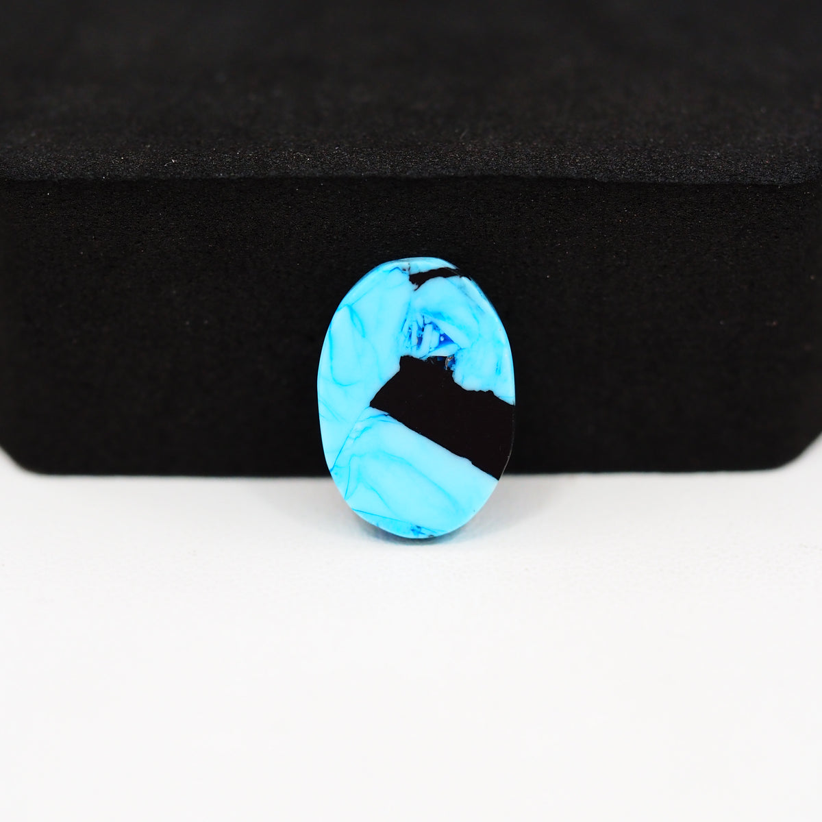 Buffalo Oval Cabochon 16x11mm 6.5ct - Blue with Black Inclusions - Pedra Gems