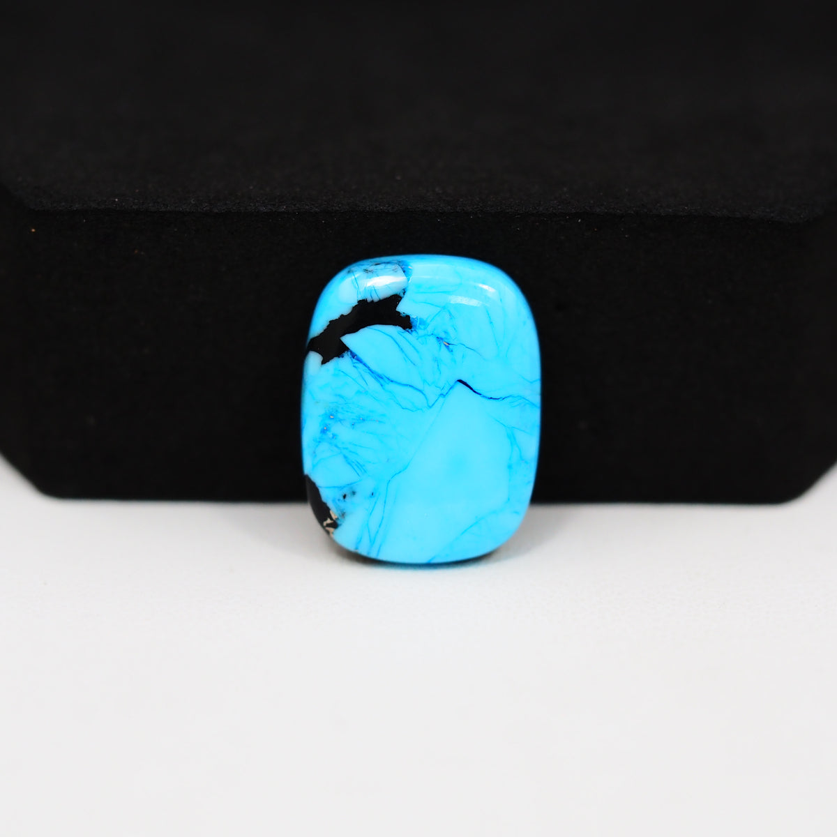 Buffalo Cushion Cabochon 18x14mm 9ct - Blue with Black Corner - Pedra Gems