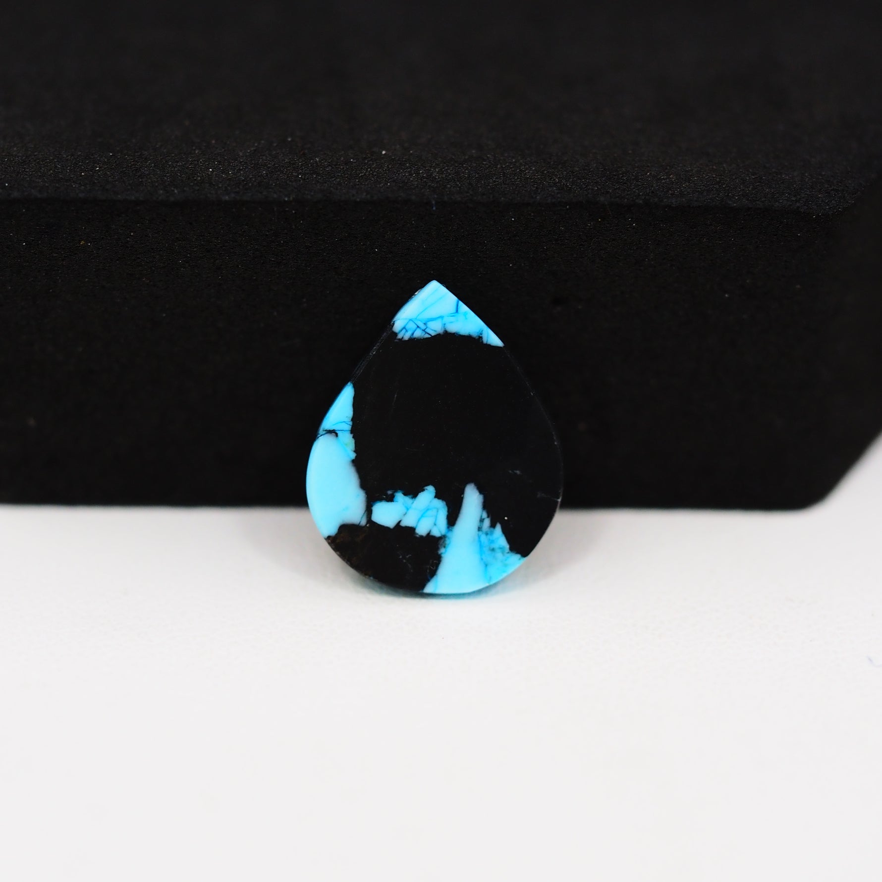 Buffalo Pear Cabochon 16x13mm 6.5ct - Black Top Blue Base - Pedra Gems