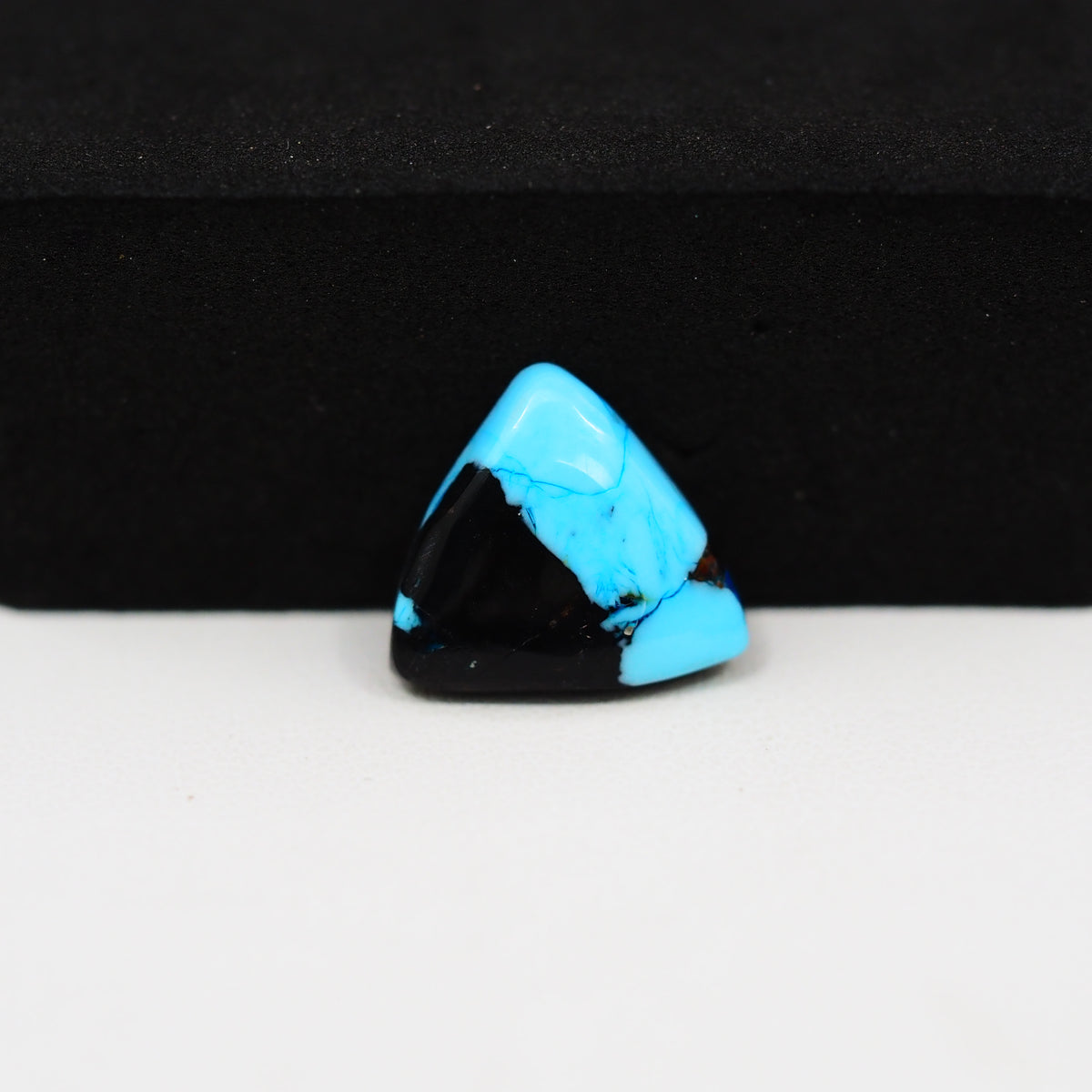 Buffalo Triangular Cabochon 12x14mm 4ct - Blue with Black Base - Pedra Gems