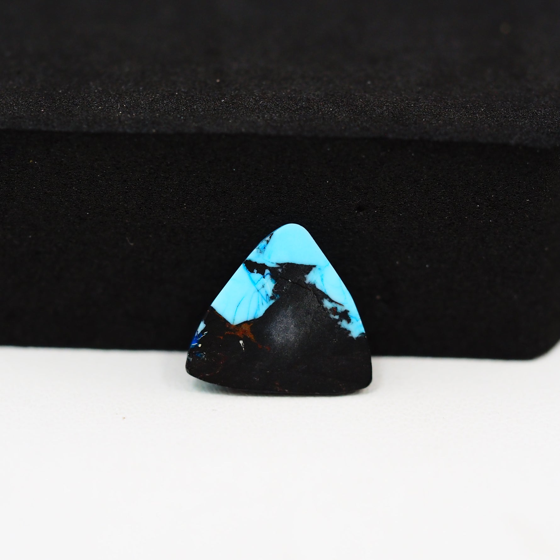 Buffalo Triangular Cabochon 12x14mm 4ct - Blue with Black Base - Pedra Gems