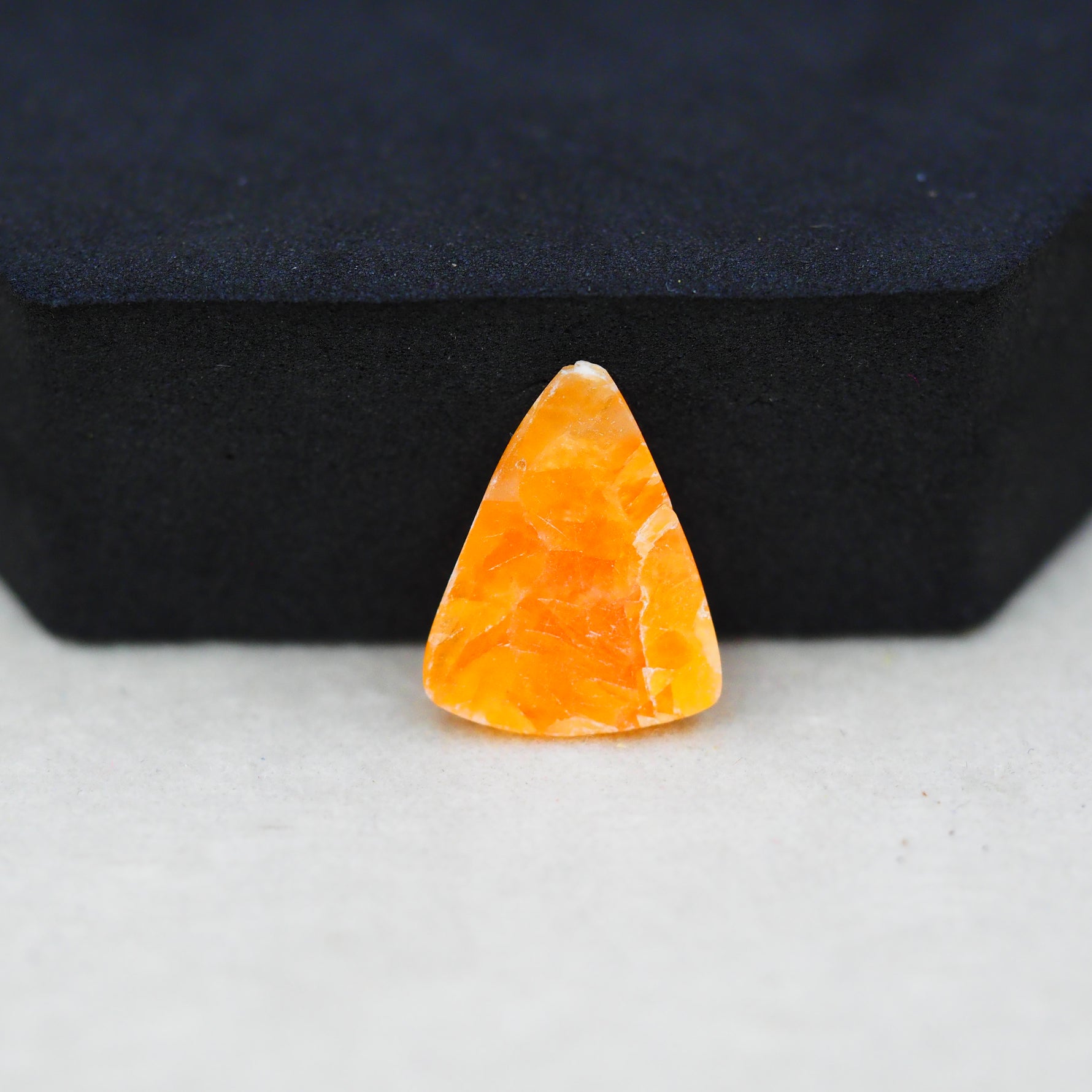 Natural Orange Calcite Trillion Cabochon 18x14mm 6ct - warm honey-orange - Pedra Gems.