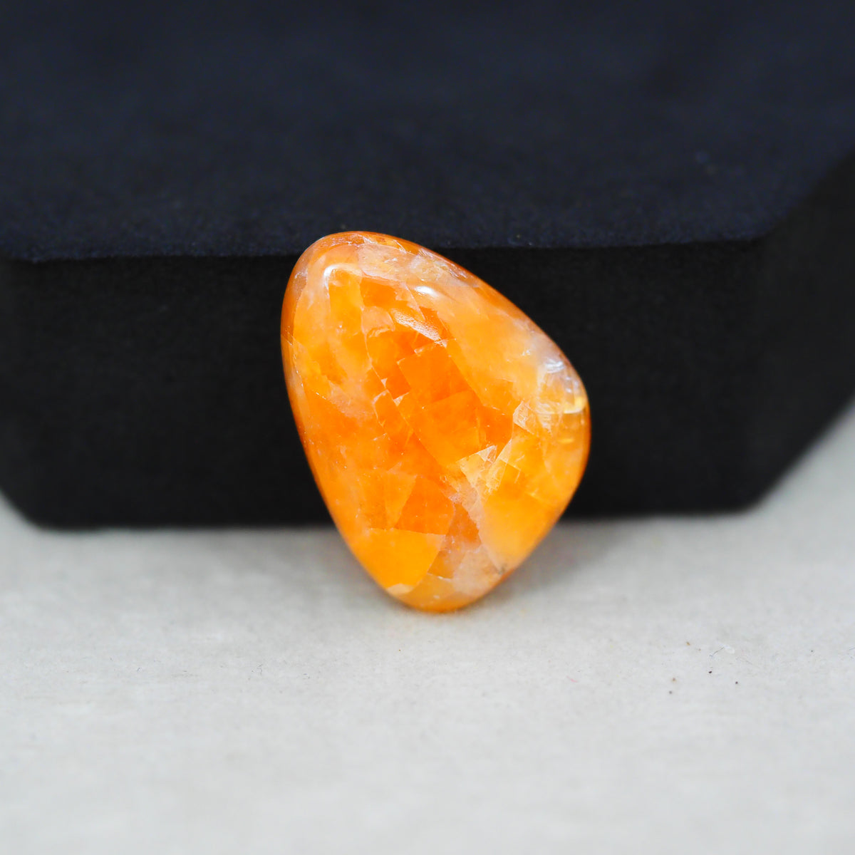 Natural Orange Calcite Trillion Cabochon 24x17mm 17.5ct - warm honey-orange - Pedra Gems.